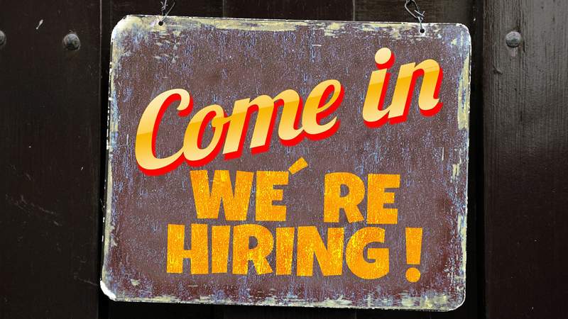 Picture of a sign that reads "Come in, we're hiring"